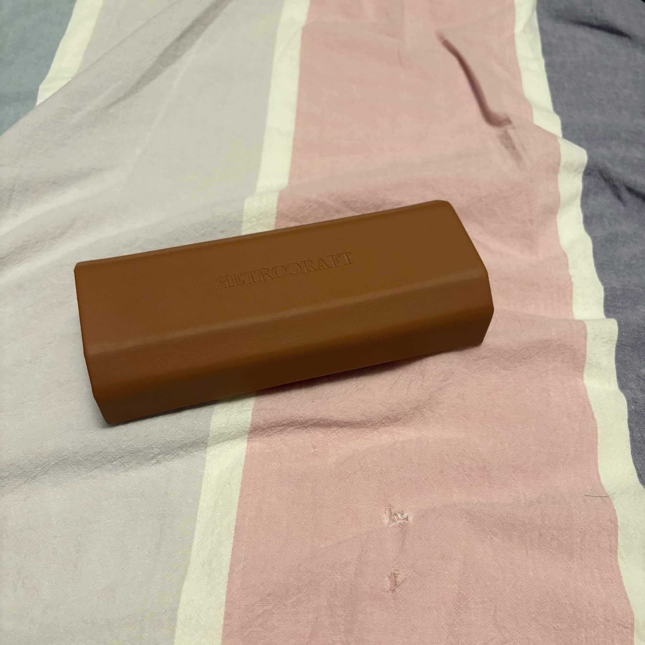 My glasses case. Also an additional gift when you bought a new pair of glasses, hopefully. You really don't want to see me wearing glasses, trust.
